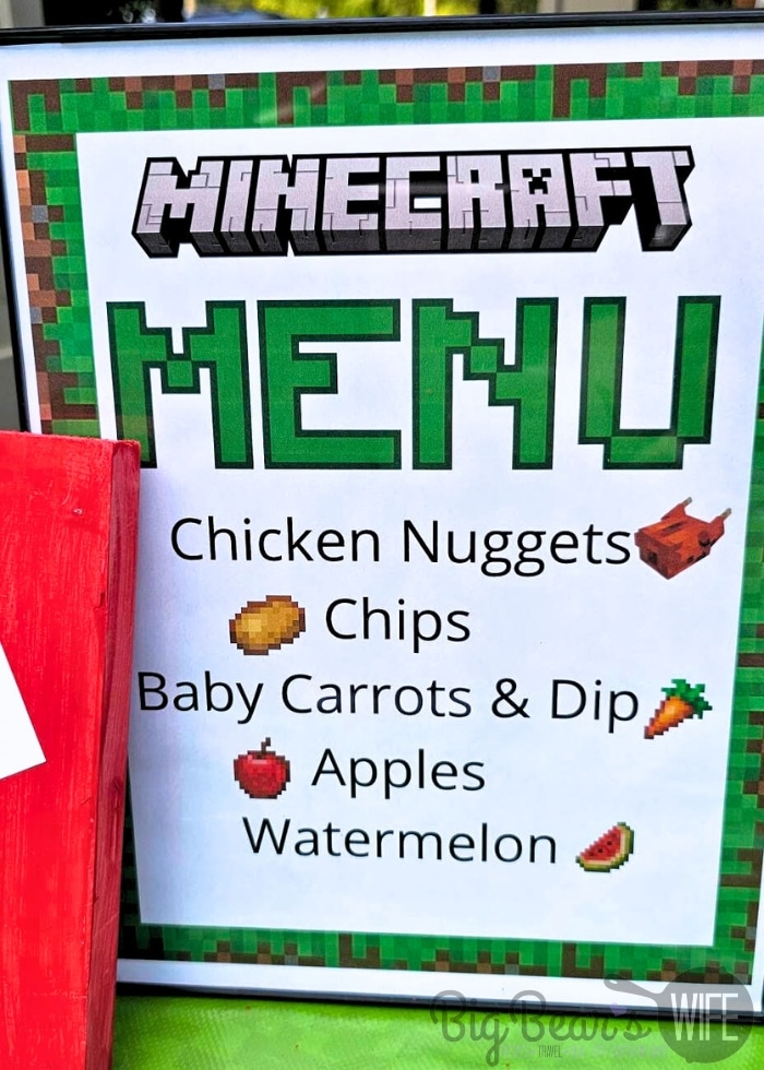 Minecraft birthday party menu sign with kid-friendly food ideas for a backyard party